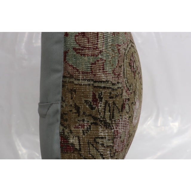Pillow made in a patchwork format from an early 20th century kerman rug