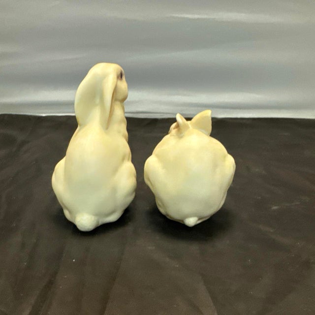 The product is a set of two vintage Cybis Porcelain Figurines featuring a bunny named Mr. Snowballs and Bon Bon,...