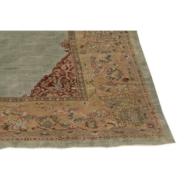 This is an antique Sultan Abad rug from the late 19th century. This original Persian rug is one of a kind and features a...