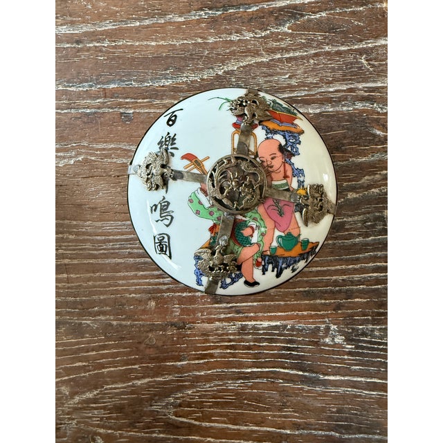 Unusual antique Chinese porcelain trinket or incense box featuring hand-painted polychrome decoration and an elaborate...