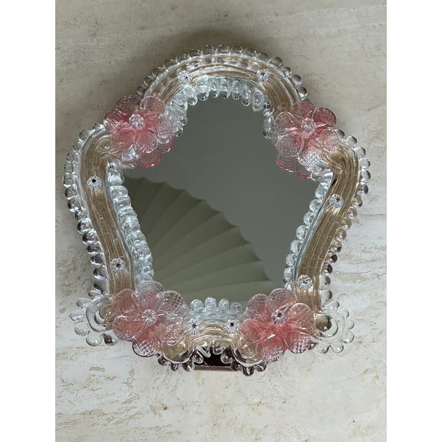 Handblown Murano glass tabletop mirror with a hook to use as a wall mirror.