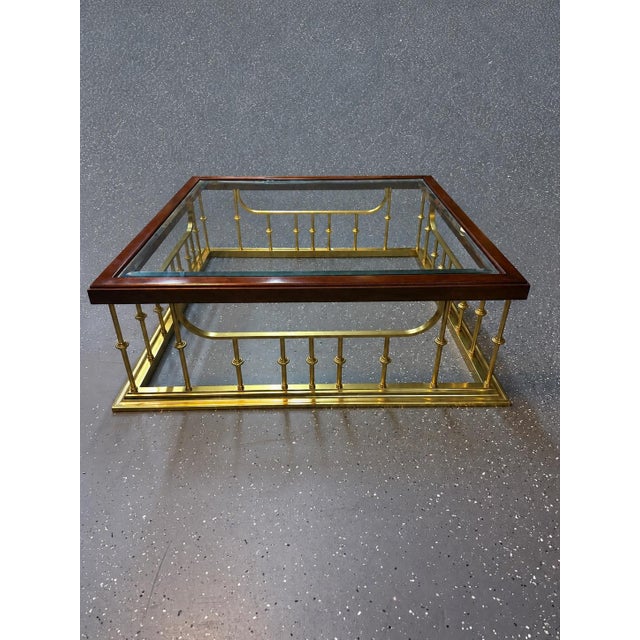 This is a striking vintage coffee table by Erwin Lambeth, featuring the designer's distinctive fireplace-fender-inspired...
