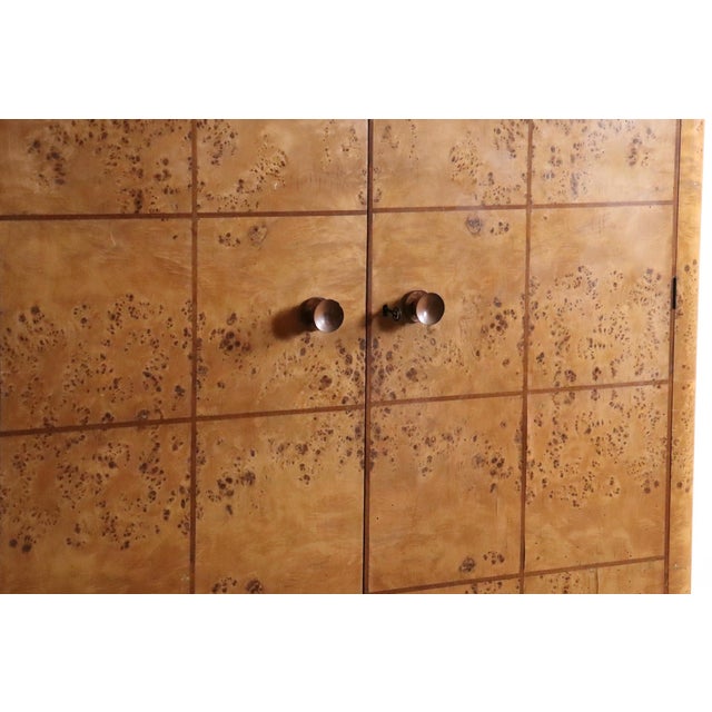 Striking art deco wardrobe from italy, made in circa 1930s, crafted in warm burl walnut with fine inlaid walnut detailing....