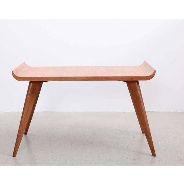 Very elegant Pagoda side table or coffee table in excellent condition. The solid feet are a little like Jean Prouvé style....