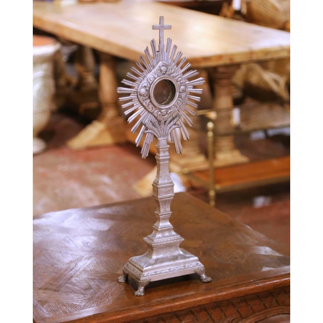 This important antique French Catholic ostensoir monstrance was crafted in France circa 1850 and exemplifies the refined...