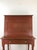 This antique schoolmasters desk features hardwood construction, newer red painted finish, drop front writing surface with...