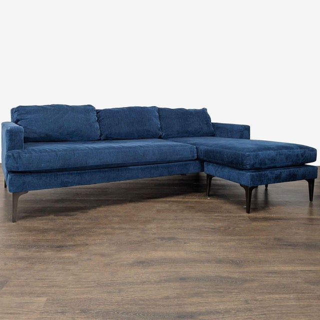 This West Elm sectional sofa features a rich blue fabric and a right-facing chaise for comfortable lounging. The clean...
