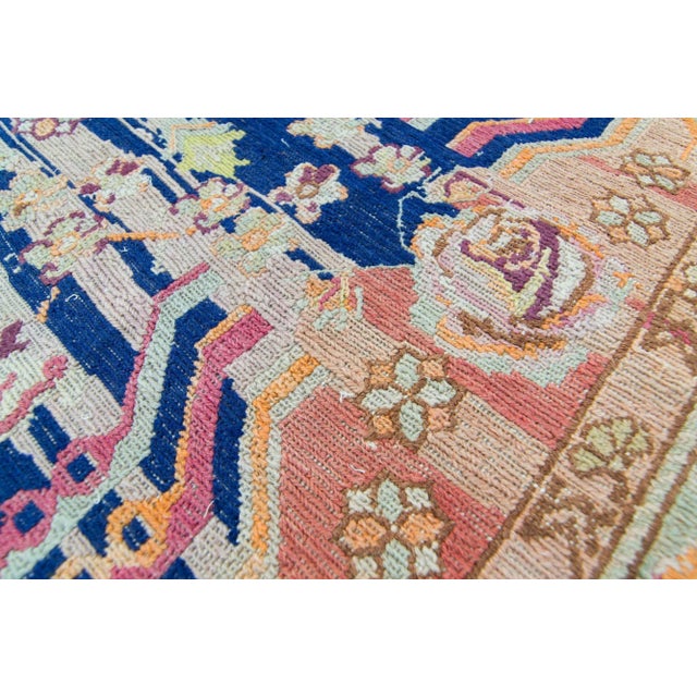 A charming rug with an allover floral motif as the focal point. Featuring a soft color palette of peach, pink, tangerine,...