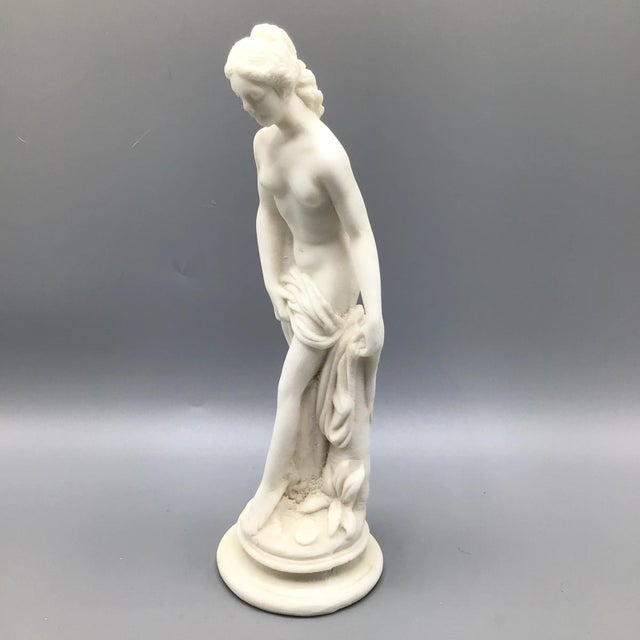Here is a bathing Greek female statue made from crushed marble mixed with epoxy then placed in a mold. The figure is...