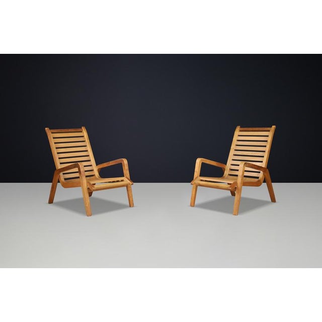 Pair of Sculptural Ashwood Lounge Chairs by Jan Vaněk, Czech Republic, 1960s A sculptural pair of ashwood lounge chairs by...