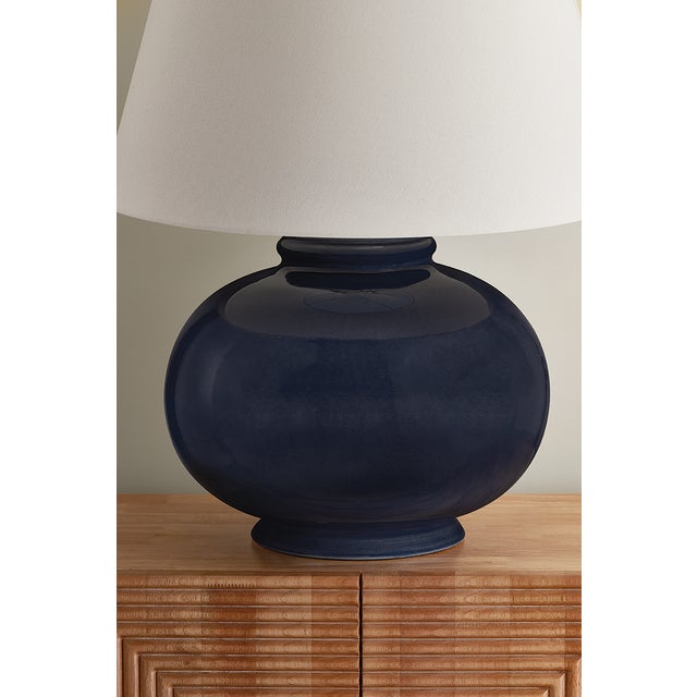 Playful color meets classic charm in the Moodus table lamp. Finished in a glossy Parrish Blue glaze, the voluminous...