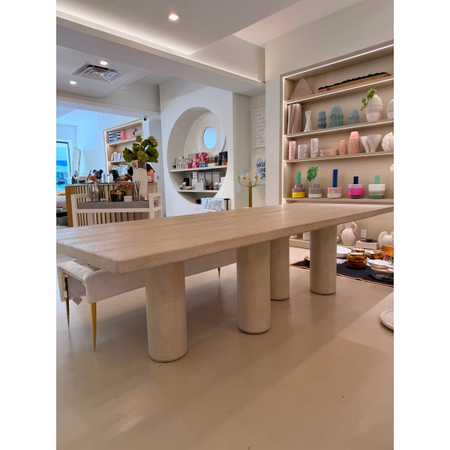 This table combines textural shagreen detailing with modern oak craftsmanship. This dining table adds a bold, sculptural...