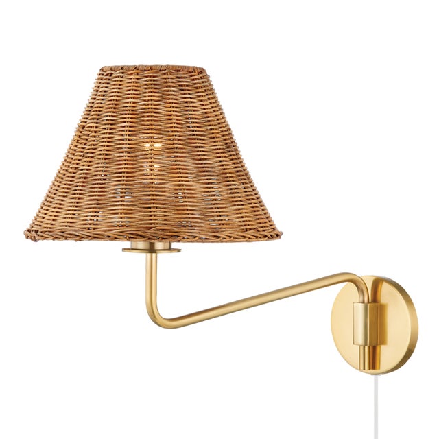 Issa has a natural style that's ahead of the curve. Slender, hooked arms hold a woven rattan shade that lets a soft light...