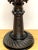 Exceptional 19th century Irish carved bog wood castle motif candlestick, Intricately carved, the bobeche with a continuous...