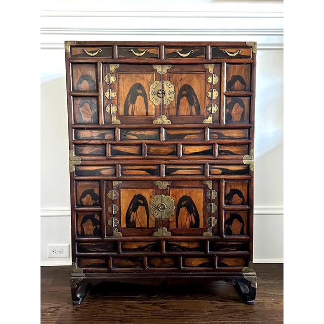 A two-tier stacking storage cabinet on comforting stand, known as Nong in Korean, circa early 20th century (end of Joseon...