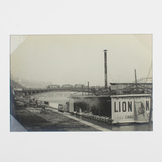 A unique original silver gelatin black and white photograph by French press Agency. View of the Rhone River in Lyon,...