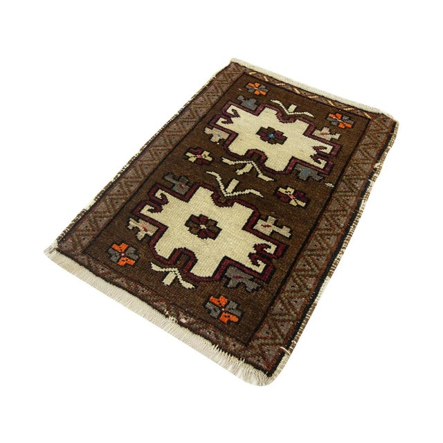 Vintage Handknotted decorative mini rug from Kars region of Turkey. Approximately 45-55 years old. In very good condition.
