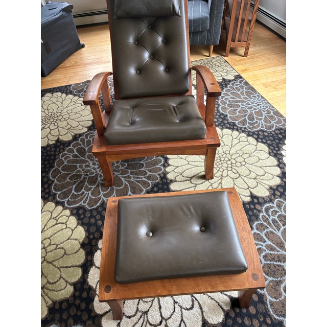 Iconic handcrafted Lolling Chair and matching ottoman by Thos. Moser, one of the company’s most recognized contemporary...