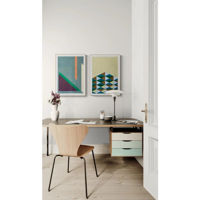 This playful geometric design features stacking rows of triangles in khaki/pale yellow, light blue, green and brown. Made...