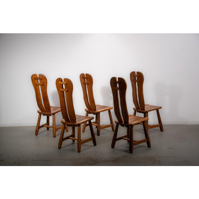 De Puydt Belgium was well known for their siplistic brutalist designs in solid oak in the 1970s. this set of 5 chairs have...
