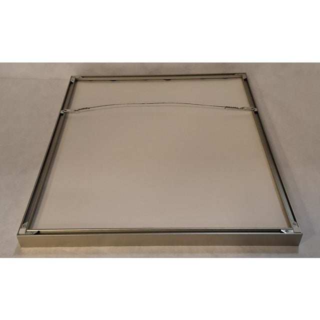"Working Proof" by Jean Sariano. Print c. 1979. Edition 171/300. Silver metal frame with print behind glass. 21"W X 1.5"D...