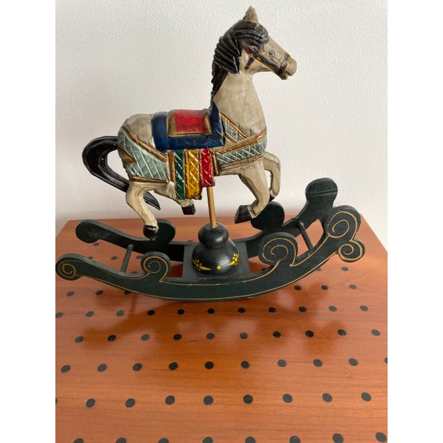 These antique toy rocking horses will surely rock you! The largest horse, made of wood, is mounted on an artfully carved...