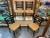 Set of four ladder-back dining chairs from 1960s Sweden, featuring black lacquered wood frames and hand-woven rope seats...