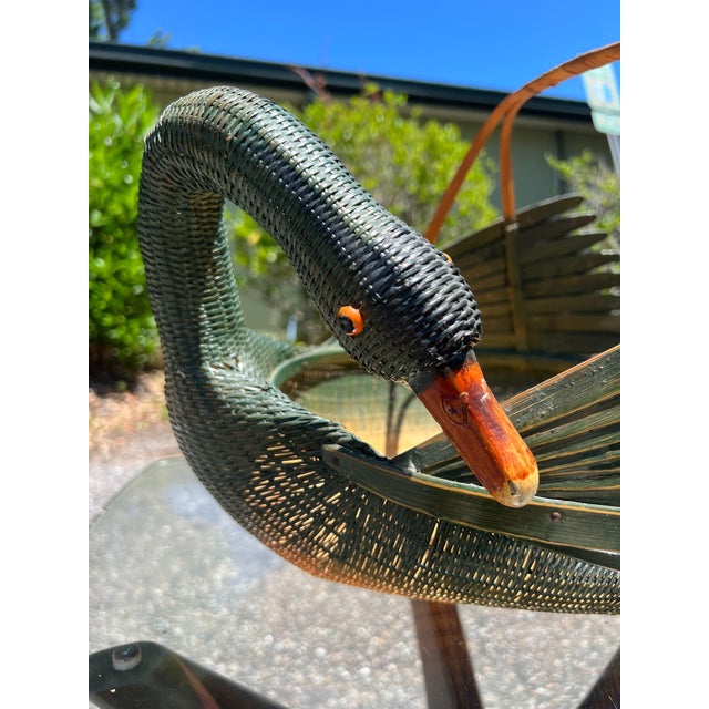 A beautiful large goose or swan from basket in a wicker rattan body and bamboo feathers, beak and handles. She is in...