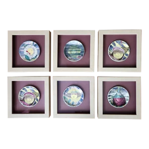 Piero Fornasetti Framed Set of Coasters, "12 Mesi, 12 Soli" Design.
