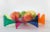 The Rainbow Fruit Bowl is a 13″ acrylic dish designed by London-based graphic artist Yoni Alter, made in Portugal. With...
