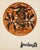 A color print by Jean Lurçat (1892–1966) depicting a large stylized rooster within an ochre-orange disc, surrounded by...
