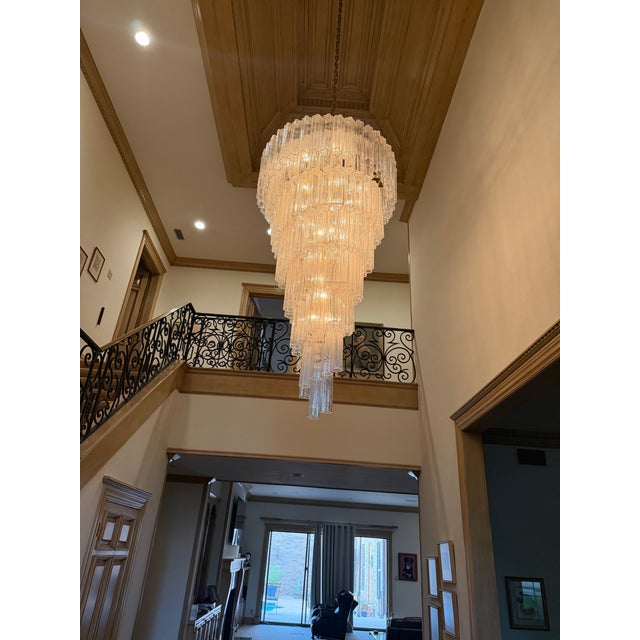 Monumental Vintage Italian Murano Style Cascading Glass Chandelier Stunning oversized multi-tier chandelier featuring...