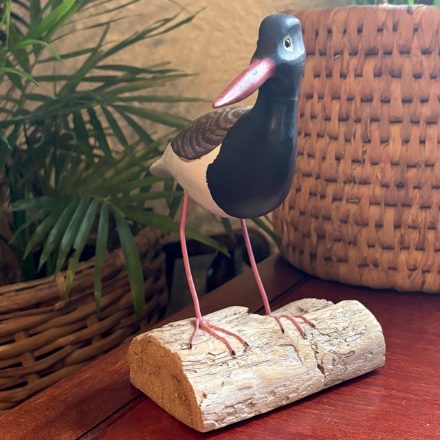 A very attractive 1980's wood statue of an American Oystercatcher standing with metal legs on driftwood. Handcarved and...