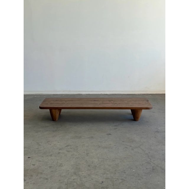 W76 D24 H11 Theo Table in reclaimed Pine by six penny. Item features a medium honey oak finish and normal wear as intended...