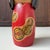 Vintage sōsaku kokeshi from the 1980s, maker unknown. The wooden doll has an elegant, slender form with a large black...
