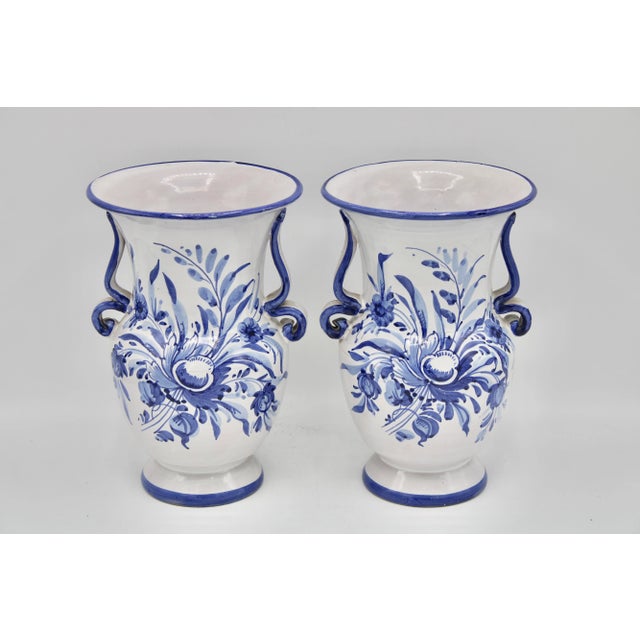 A lovely pair of Vintage Italian blue and white pottery vases. These are handmade and absolutely charming.