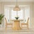 Bring breezy, coastal charm into your home or hospitality space with the Butler Specialty Company Flora Rattan Dining...