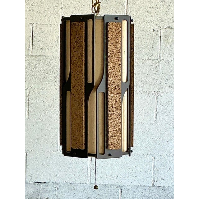 Capture the quintessential spirit of 1970s design with this striking vintage hanging light. A masterpiece of organic...