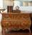 ​An exquisite, high-quality pair of mid-to-late 20th-century French Provincial style bombe commodes (or chests of drawers)...