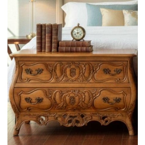 An incredible pair of oversized heavily carved bombe style French Provincial commodes by Century. The commodes feature 2...