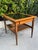 A handsome mid-century modern end table by American of Martinsville featuring a warm walnut frame, black mica inset top,...