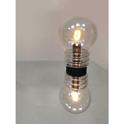 Shine bright with this 1960s/70s "bulb bubble glass table lamp." Produced by Glashütte Limburg, it features beautiful...