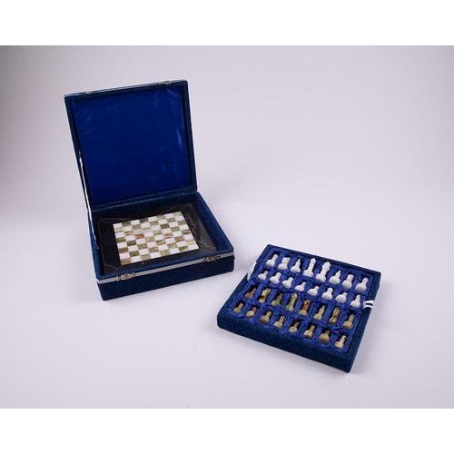 The Chess Game Green Brown and White Marble in Blue Velvet Box is a stunning blend of timeless craftsmanship and refined...