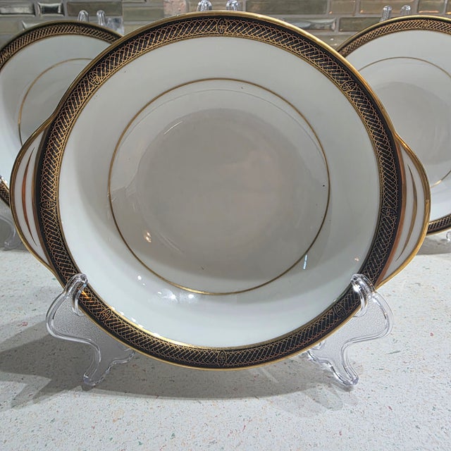 These are authentic mid-century vintage pieces. The style features a distinctive dark/black band paired with detailed gold...