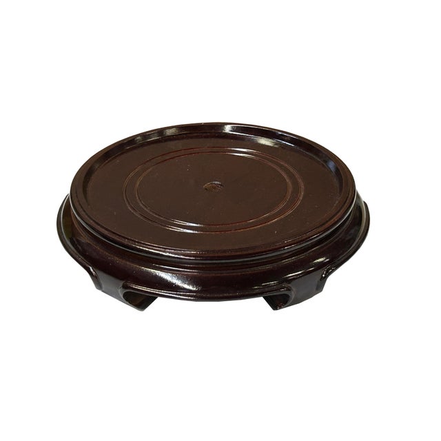 Showcase your prized possessions with this elegant, dark wood display stand. Perfect for elevating vases, statues, or...