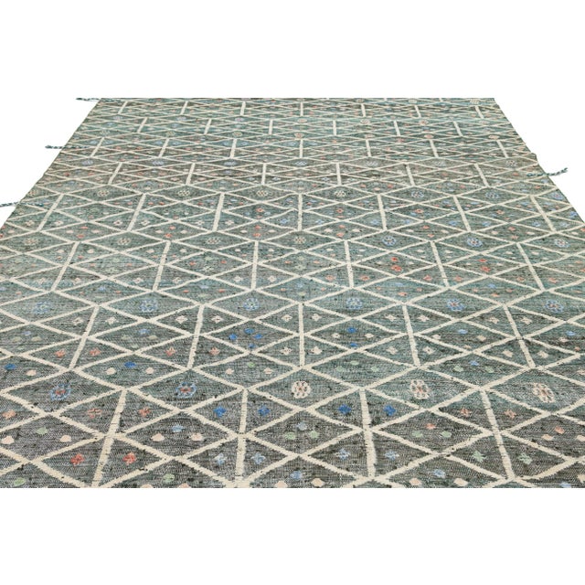 Enhance your space with this Modern Moroccan-style wool rug, seamlessly blending tribal influences with contemporary...