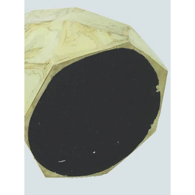 This paper weight is made from resin.