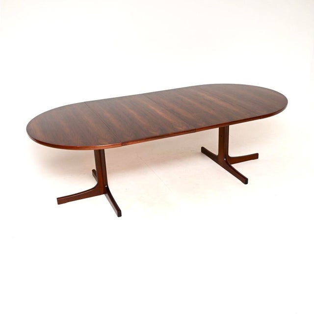 A very stylish and top quality Danish vintage extending dining table. This was made in Denmark, it dates from the 1960’s....
