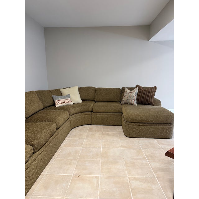 Vintage 1970’s low-profile modular sectional sofa. It’s has olive green textured upholstery and consists of multiple...