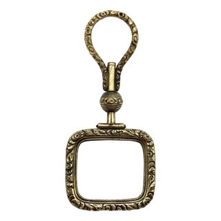 Mid 19th Century Georgian Pinchbeck Quizzing Glass With Floral Motif and Swivel Handle For Sale